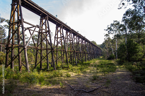 Fototapeta Wooden trestle bridge across a valley in Australia