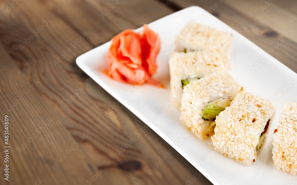 Warm sushi set on board with wassabi and soy sauce. Warm sushi set on board with wassabi and soy sauce.