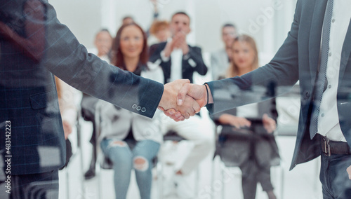 business people meet each other with a handshake photo