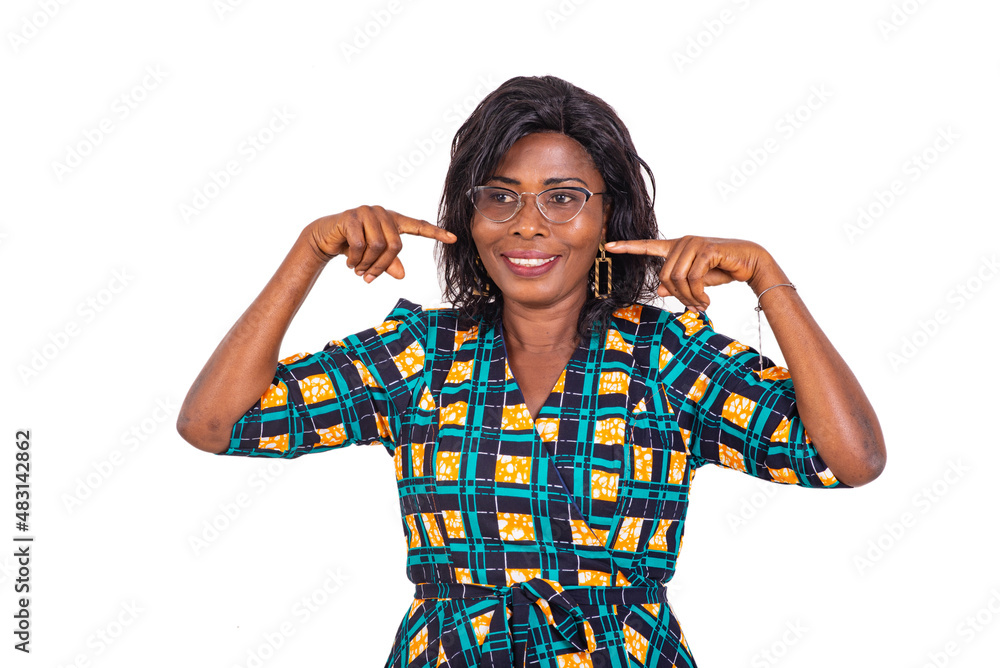 beautiful adult business woman pointing fingers at her smile while smiling. beautiful adult business woman pointing fingers at her smile while smiling.