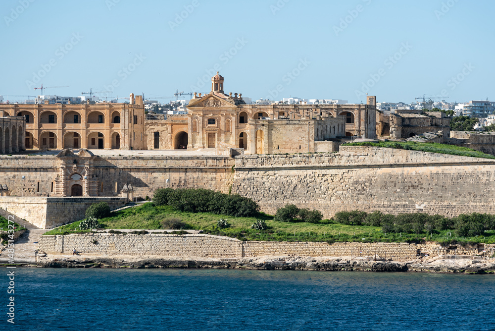 Valletta, Malta - 01 07 2022: The banks of the coastal line with historical buildings in the background