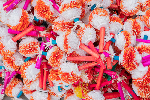 Red and white painted decorated balls made from thermocol, worship materials for Hindu devotees. Image shot at Kalighat, Kolkata, West Bengal, India photo