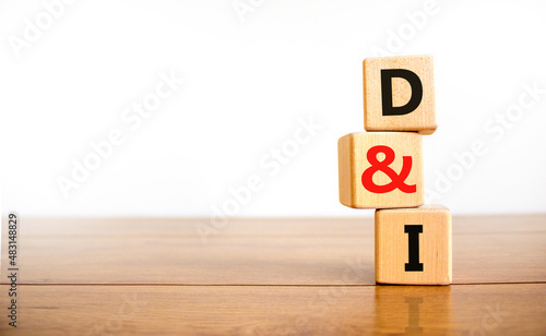 D and I, Diversity and inclusion symbol. Concept words D and I, diversity and inclusion on wooden cubes on beautiful wooden table, white background. Business, D and I, diversity and inclusion concept.