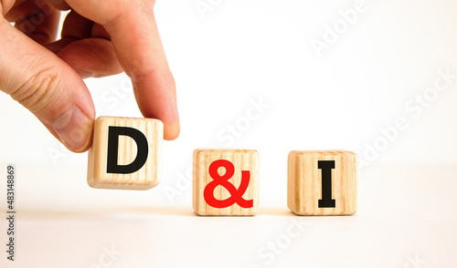 D and I, Diversity and inclusion symbol. Concept words D and I, diversity and inclusion on wooden cubes on beautiful white background. Business, D and I, diversity and inclusion concept.