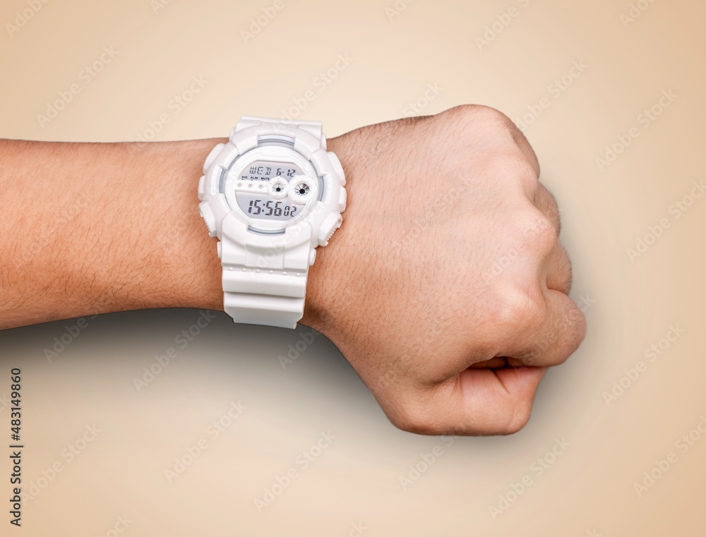 Fototapeta premium Smartwatch in a human hand on a light background