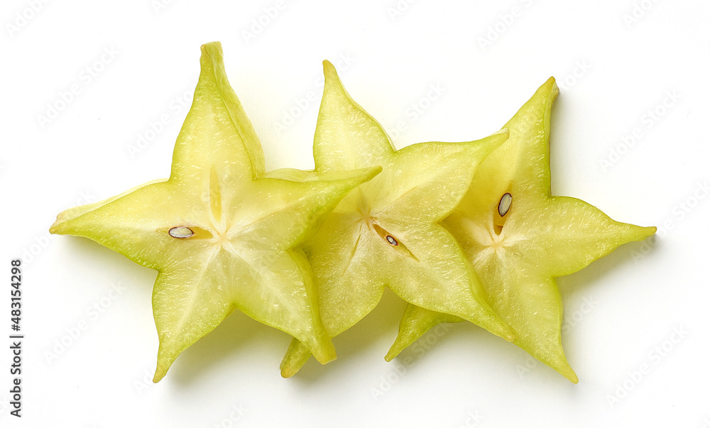 Fototapeta premium Three slices of fresh ripe carambola or star fruit