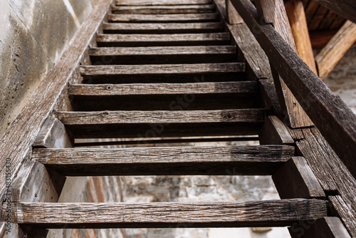 Old rustic wooden staircase fragment, outdoor. selective focus