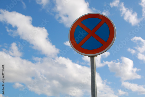No Parking Traffic Road Sign. The urban clearway sign with blue sky cloudy background.