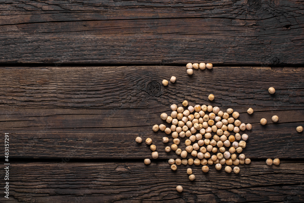 Dry grains of peas scattered on the table. Dry grains of peas scattered on the table.