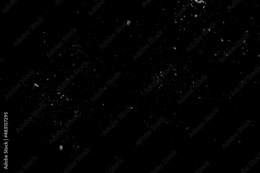Sea salt crystals on a black surface. Sea salt crystals on a black surface.