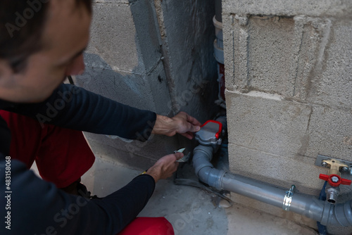 Plumber man with tools. Plumbing and renovation.