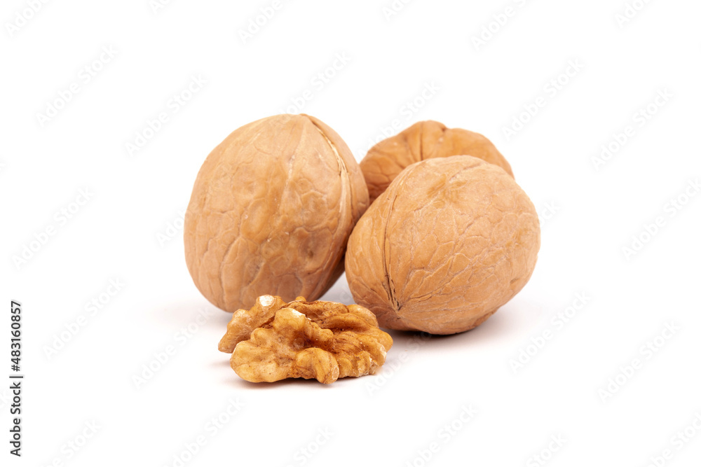 Walnuts in shells isolated on white background. Package design element with clipping path. Walnuts in shells isolated on white background. Package design element with clipping path.