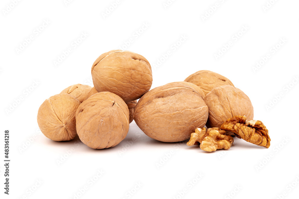 Walnuts in shells isolated on white background. Package design element with clipping path. Walnuts in shells isolated on white background. Package design element with clipping path.