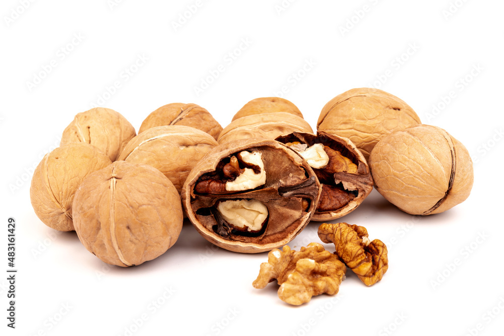 Walnuts in shells isolated on white background. Package design element with clipping path. Walnuts in shells isolated on white background. Package design element with clipping path.