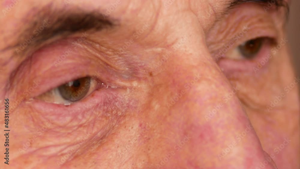 Close-up of the sad eyes of a Caucasian man over 70 years old. The look of a sad pensioner. Wrinkles on the face near the eyes of a man.Selective focus, shallow depth of field Close-up of the sad eyes of a Caucasian man over 70 years old. The look of a sad pensioner. Wrinkles on the face near the eyes of a man.Selective focus, shallow depth of field
