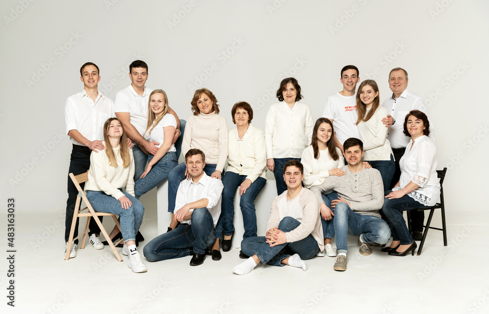 cheerful family on a white background. people of different ages and nationalities. family members. group portrait on white background