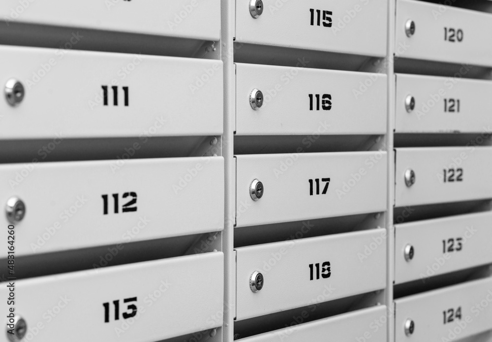 Mailboxes in the condominium. Mailboxes filled. Mail boxes filled of leaflets and letters. Mailboxes in the condominium. Mailboxes filled. Mail boxes filled of leaflets and letters.