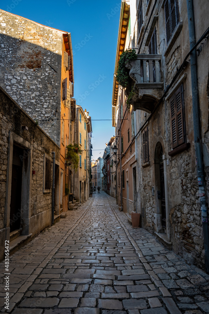 Empty, old, stone paved narrow streets of Rovinj, popular tourist destination with beautiful, colorful houses in the Istrian region of Croatia