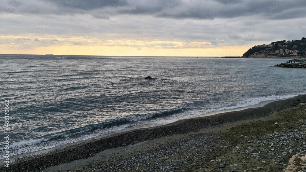 Genova, Italy - January 12, 2022 - Seascape, blue sky, clouds and sea in the tropical waters of the Mediterranean sea in winter days.