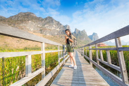 Hiking. Asian female hikers carry heavy backpacking on hiking trails. Live a healthy life