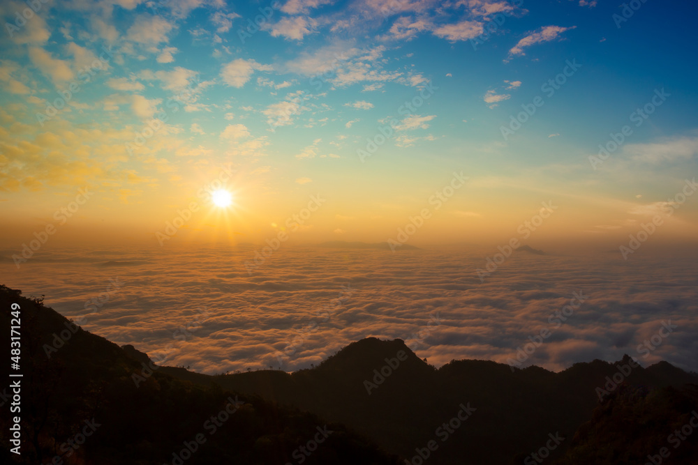 An early morning landscape with the sea of ​​clouds below and the morning sun rising