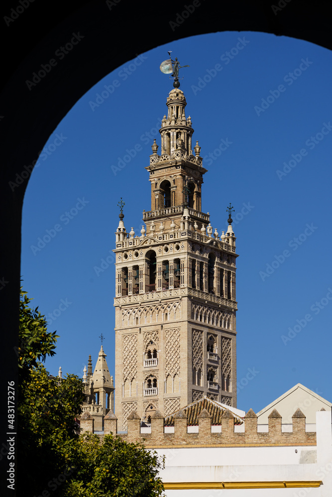 The Giralda bell tower, an ancient minaret, of the Seville cathedral on a sunny day in Andalucia main city in Spain