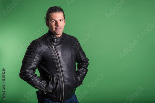 portrait of spanish man on green studio background © FotoAndalucia