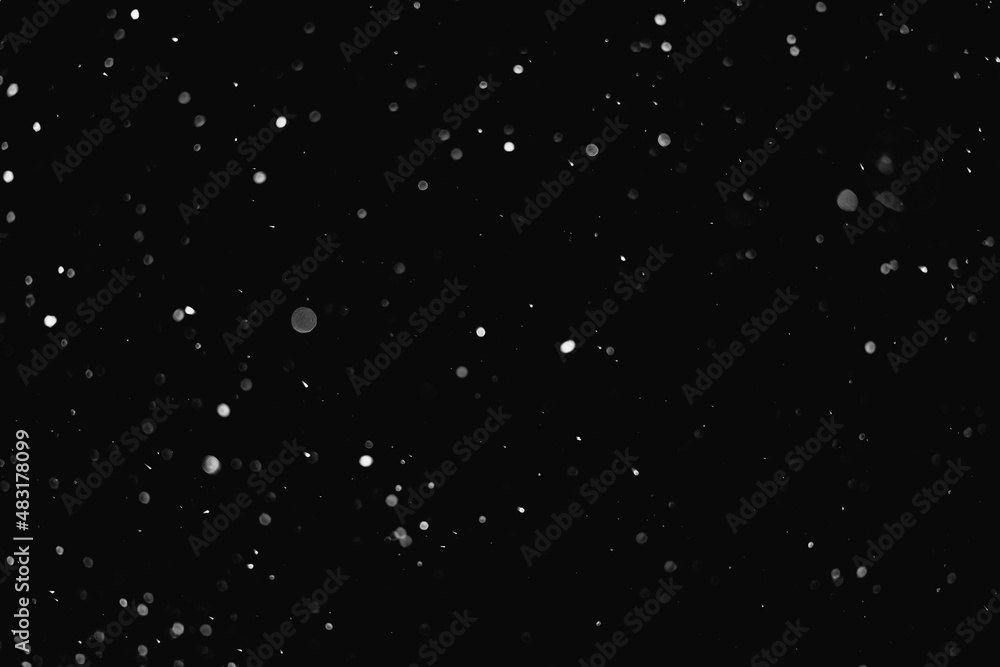 Night sky and falling snow.