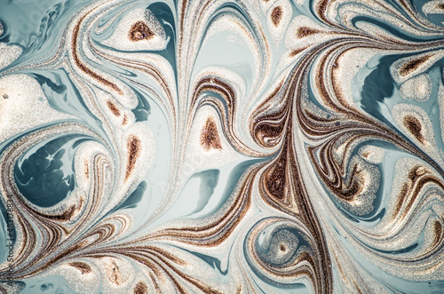 Marbleized effect. Natural Luxury. Liquid marble pattern with golden powder. Ancient oriental drawing technique.