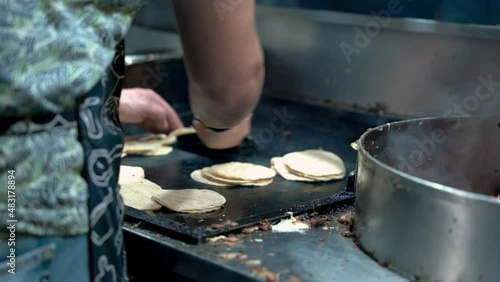 Chef flipping tortillas 