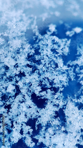 abstraction of white snow on a blue background 