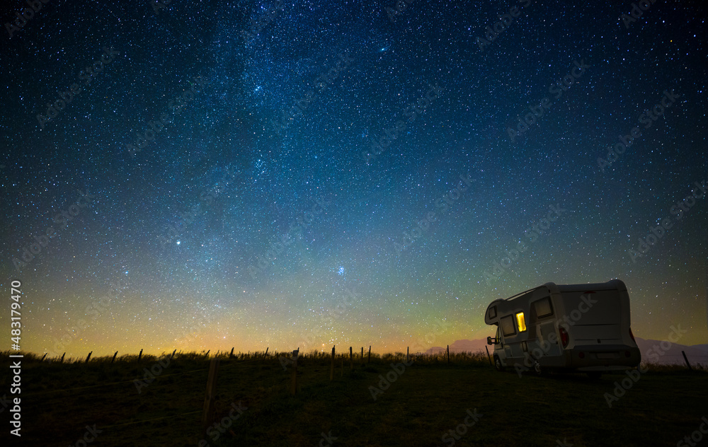 Fototapeta premium Caravan at night under the starry sky, milky way, concept for camping, galaxy, universe