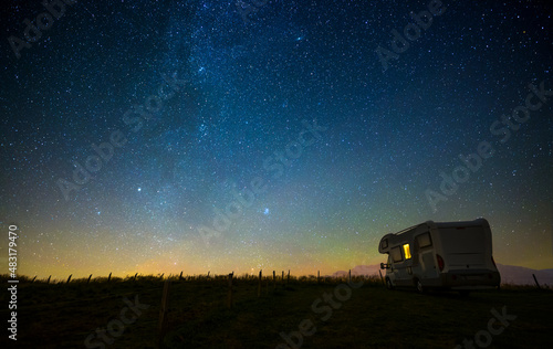 Caravan at night under the starry sky, milky way, concept for camping, galaxy, universe © SD Photography
