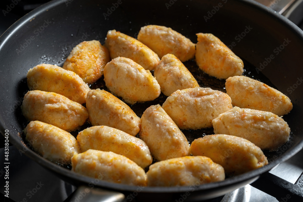 Dumplings in a frying pan. An old Russian dish otluchentsy or kartoflaniki Dumplings in a frying pan. An old Russian dish otluchentsy or kartoflaniki