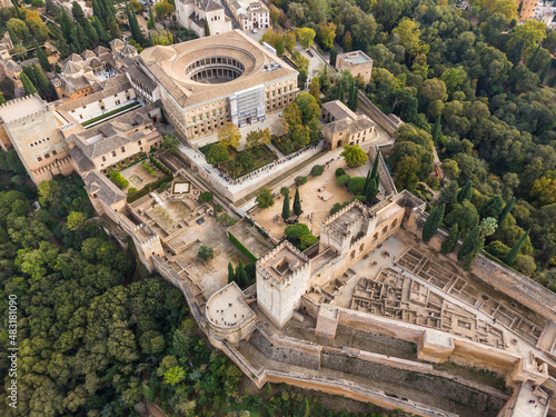 Dramatic aerial view of the Alhambra with the Charles Quint and the Nasrides palaces in Granada old town in Andalusia in southern Spain.