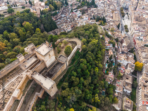 Dramatic aerial view of the Alhambra palace and fortress in Granada with the Torre de la Vela tower in Andalusia in southern Spain.