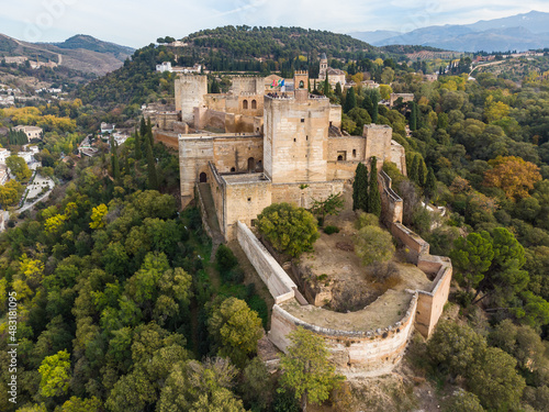 Obraz na płótnie Dramatic aerial view of the Alhambra palace and fortress in Granada with the Torre de la Vela tower in Andalusia in southern Spain. w salonie