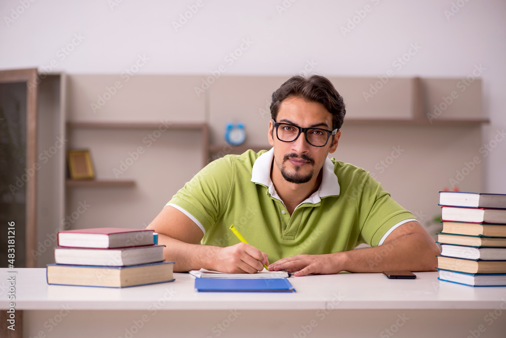 Young male student studying at home Young male student studying at home