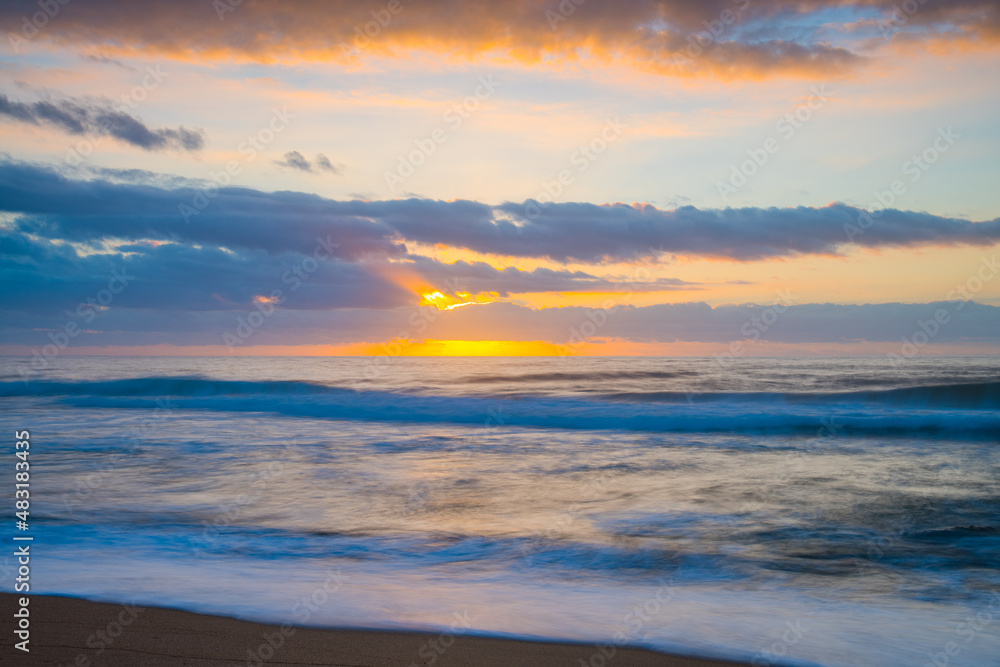 Soft sunrise seascape with clouds
