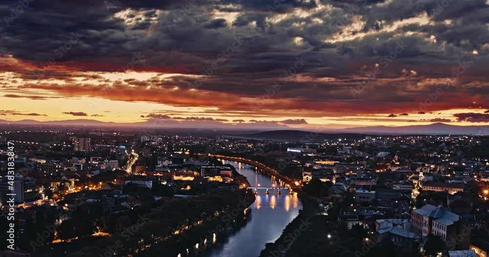 Aerial shot: Incredible sunset over the city. View of the city of Uzhhorod and the river Uzh. 4k Aerial shot: Incredible sunset over the city. View of the city of Uzhhorod and the river Uzh. 4k