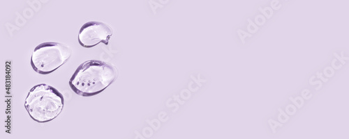 Obraz na plátně Transparent hyaluronic acid gel on a lilac background.