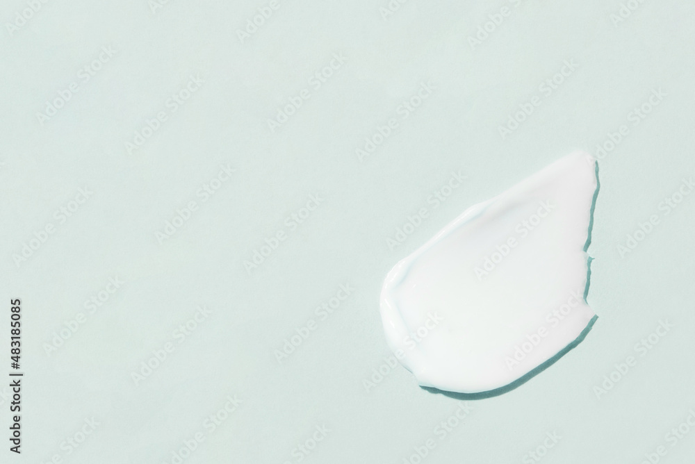 Smear of cream on a blue background. Smear of cream on a blue background.