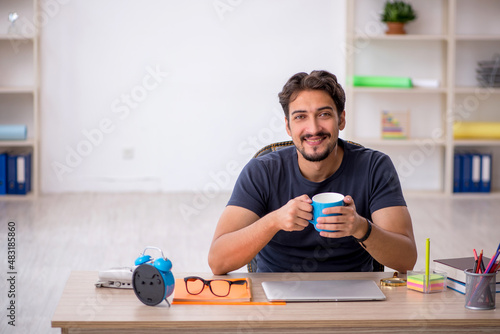 Young male designer working in the office
