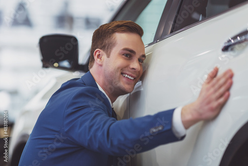 Young businessman in motor show