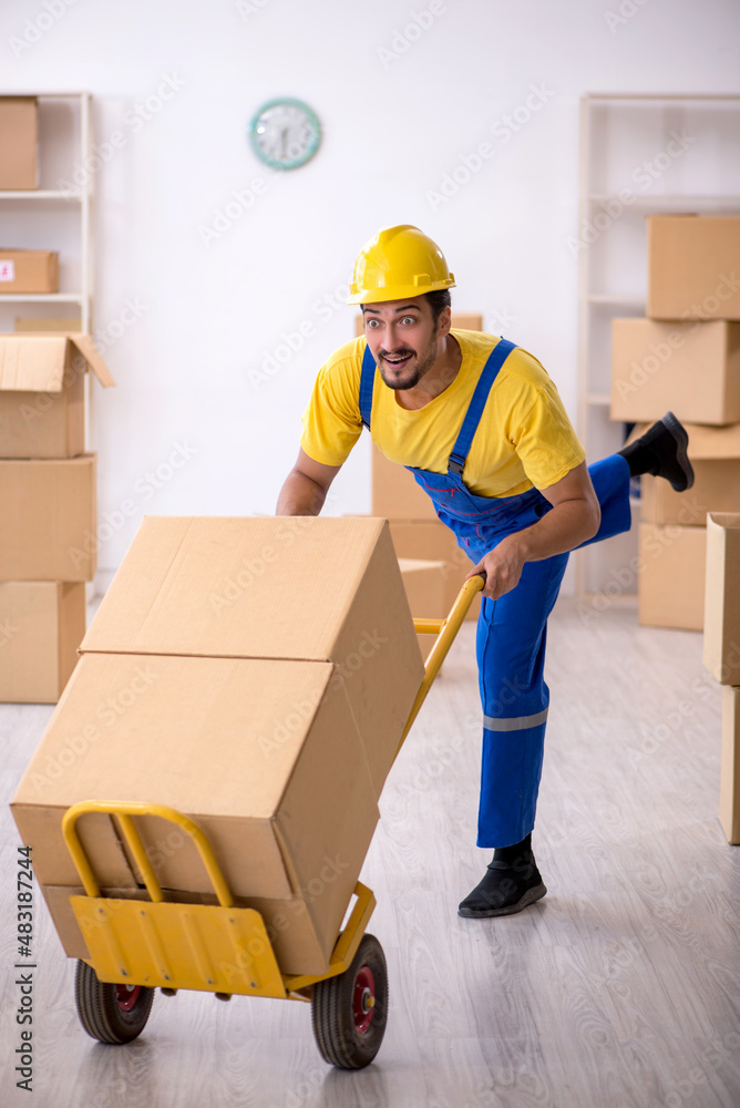Young male contractor doing home relocation Young male contractor doing home relocation