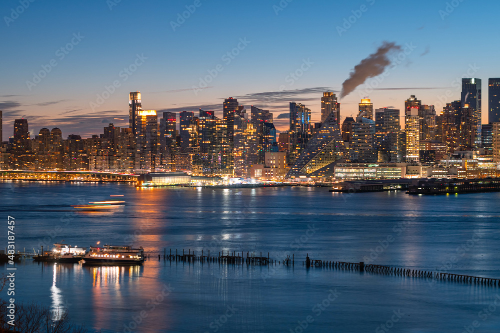 Fototapeta premium Vivid Manhattan skyline taken right before sunrise, wonderful architecture in low light, long exposure technique.