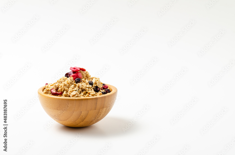 Granola in bowl on white background
Granola in bowl on white background