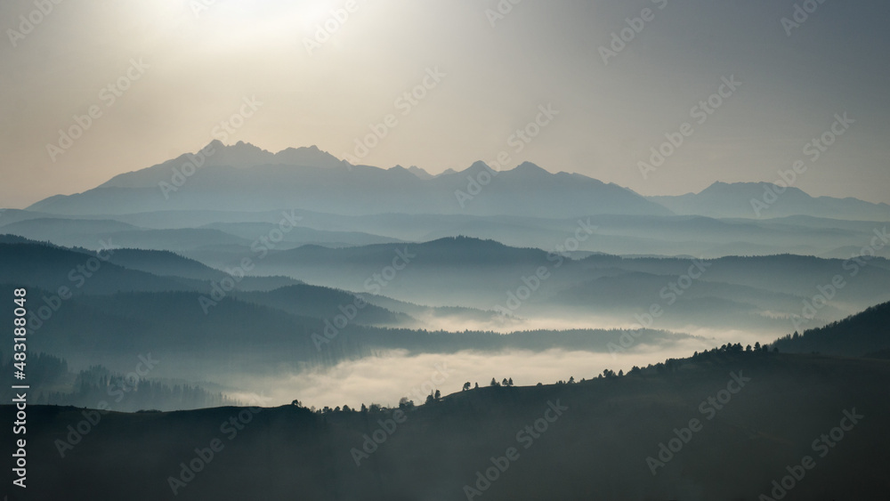 View of Tatras from Wysoki Wierch in the Pieniny National Park during late afternoon, Poland