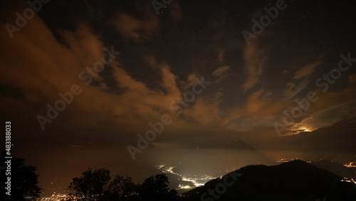 Sunset at night with starry sky, clouds and long exposure