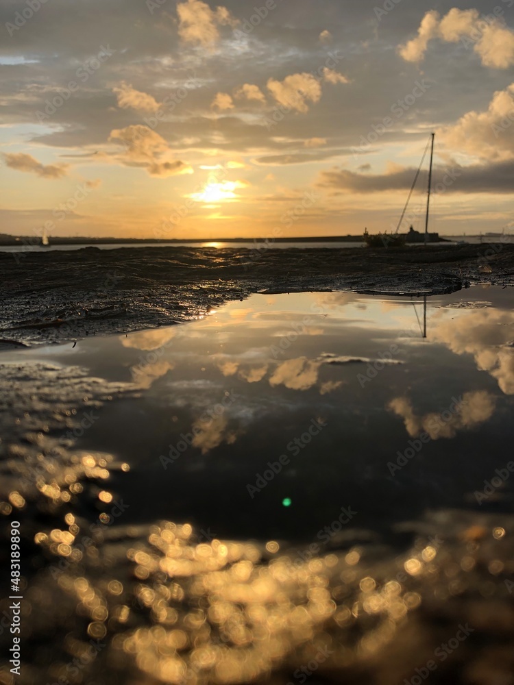 Sunset in puddle